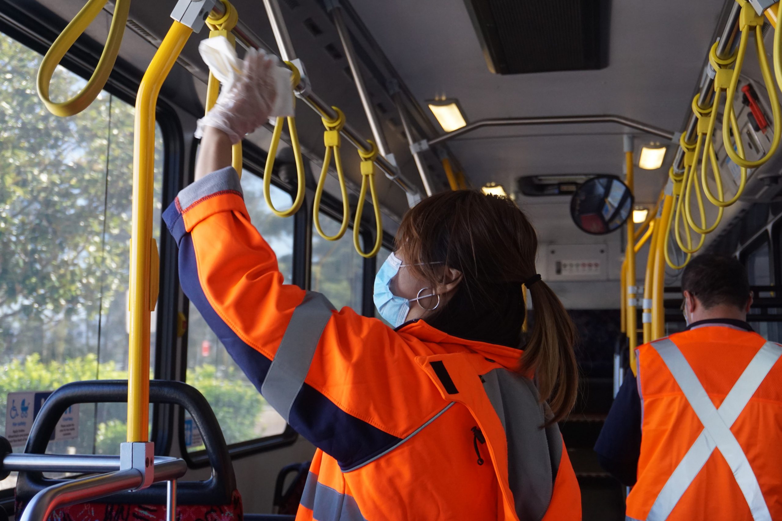 Team cleaning bus